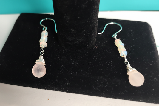 Sterling silver opal and rose quartz briolette earrings on black display