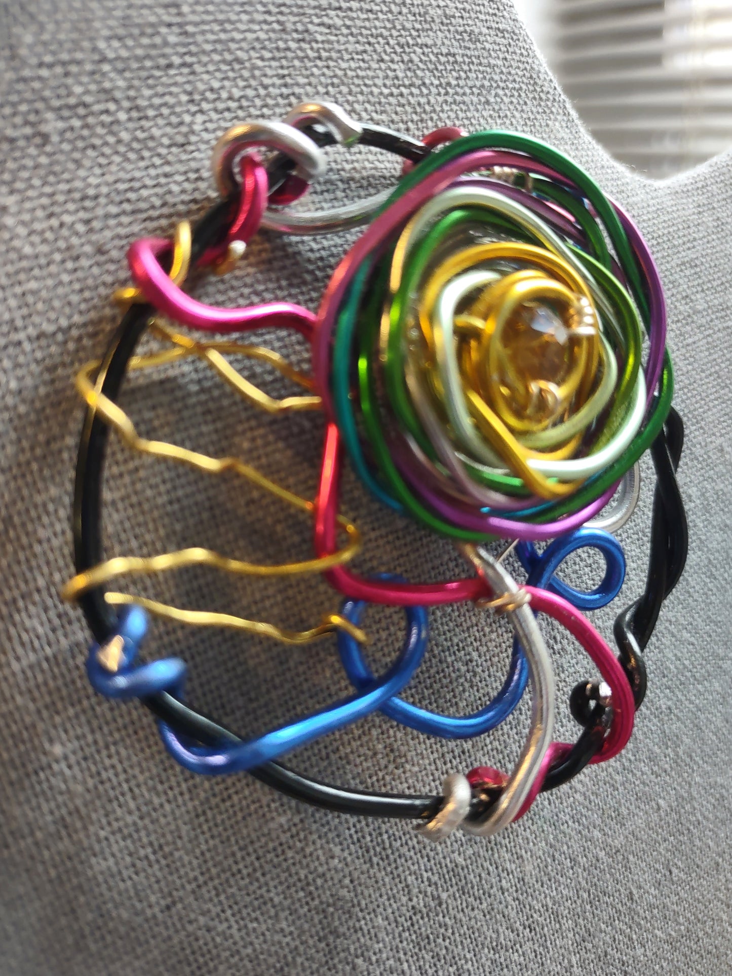 Black Aluminum Wire Rose Brooch Pin with Gold Crystal Center