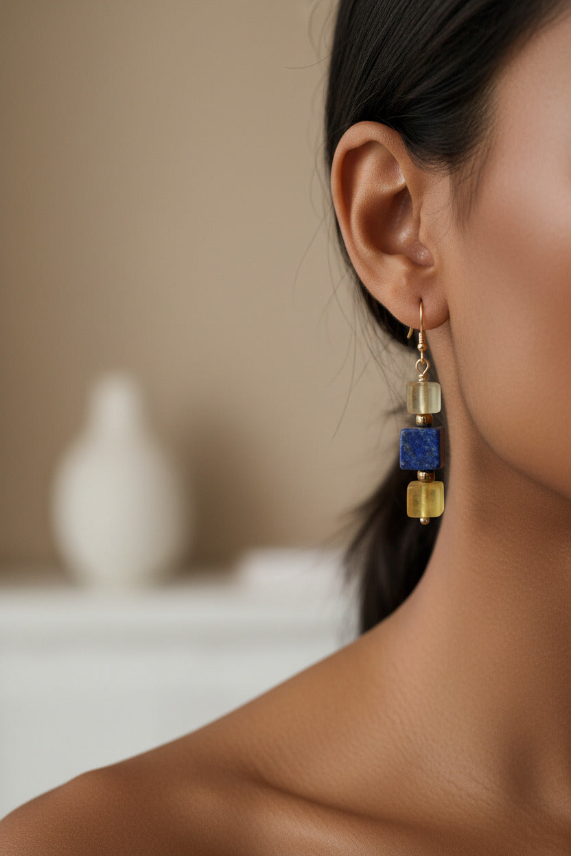 A pair of dangle earrings with cubed lapis lazuli  & Yellow Fluorite beads, with Czech glass spacers in gold. 