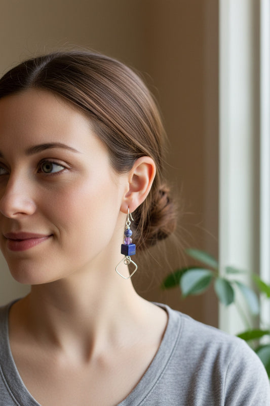 A pair of handmade Earrings with Mexican Soda lite, Amethyst , and Lapis Lazuli beads. 